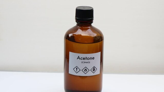 Acetone in bottle , chemical in the laboratory and industry