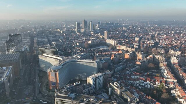 Skyline of Brussels, Belgium. Europe. Urban city overhead aerial drone view. Infrastructure, office buildings, real estate housing. Sunny winter day. City park of capital of Belgium.