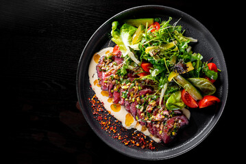 Roastbeef salad with vegetables on plate