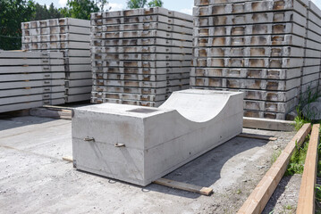 Reinforced concrete foundation along an iron pipe at the warehouse of the reinforced concrete plant.