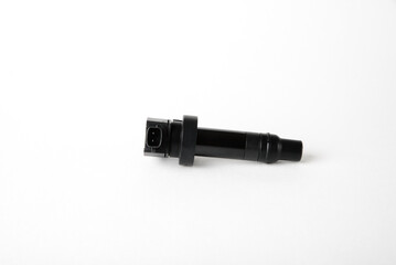 Isolated on a white background the ignition coil of an internal combustion engine.