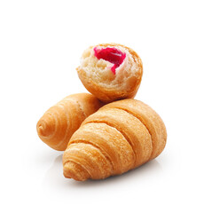 Fresh french croissants with fruit filling, whole and half, isolated on white background   