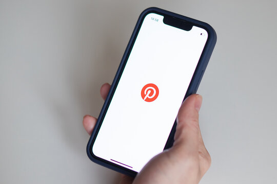 Pinterest logo, Pinterest app on the screen of the phone, a female hand holds a smartphone, Georgia, Batumi, December 6, 2022