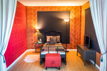 modern classic bedroom showing vintage iron single bed with modern fabric stool and vibrant wall material - 561257745