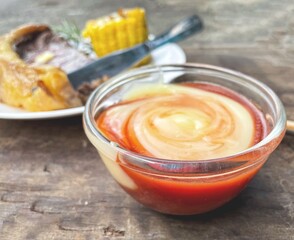 Tomato sauce with mayonnaise and beef steak