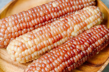 Delicious boiled waxy corn food served on the table