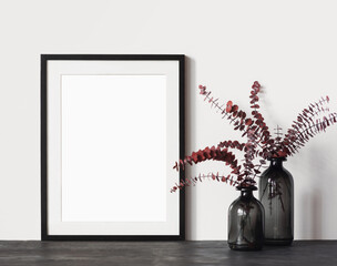 Blank picture frame mockup on white wall in rustic interior. Artwork template mock up in minimal interior design 