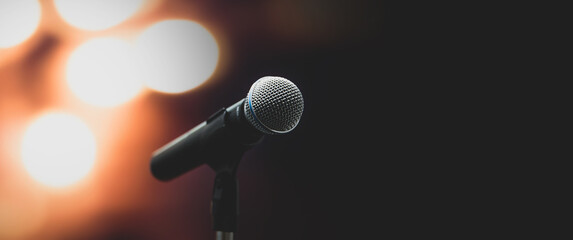 Microphone Public speaking background, Close up microphone on stand for speaker speech presentation stage performance or press conference background.