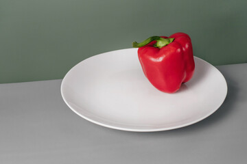 Fresh bell pepper on table. Red Vegetable. Creative trendy healthy food for diet with copy space