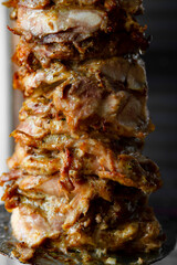 Man cutting prepared meat for Shawarma