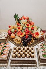 Beautifully decorated catering banquet table with different food snacks
