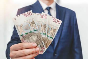 Polish 500 PLN banknotes in hand