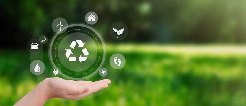 Hand with recycling and eco symbols
