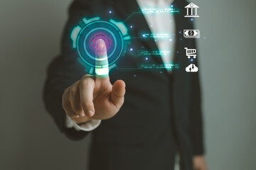 Man using thumb to scan finger print or for digital processing biometric identification to access security system includes internet banking, cloud system and mobile phone , Cyber security concept.
