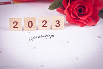 2023 plan wedding on calendar background.