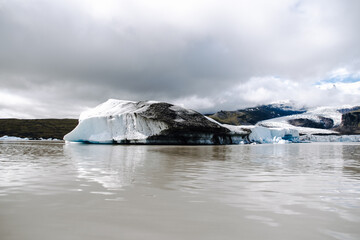 Many icebergs and ice floes in the glacial lagoon Fjallsárlón in iceland, which has broken away...