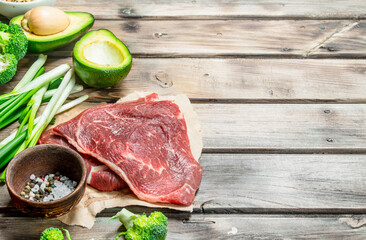 Healthy food. Variety of organic food with raw beef meat.