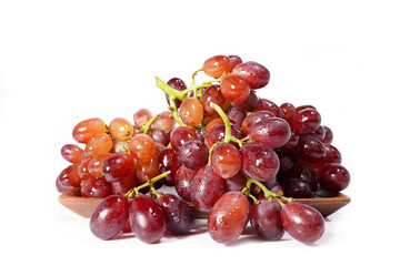bunch of red seedless grapes on a white background