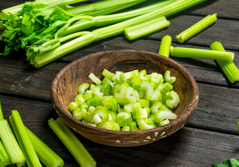 Pieces of celery in a wooden bowl.