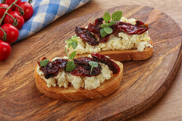 Bruschetta with soft cheese and tomato