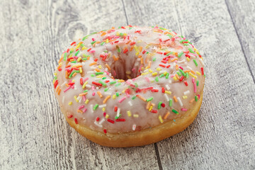 Sweet glazed vanilla donut with icing