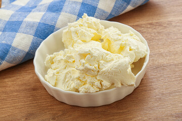 Italian soft mascarpone cheese in the bowl