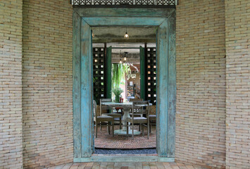 Fototapeta na wymiar Furniture set in the restaurant behind the entrance door.