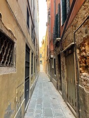 narrow street in venice city near rialto bridge 