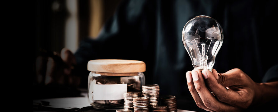 Close up hand choose light bulb or lamp for human resources or leadership and creativity thinking idea motivation or vision and knowledge learning and study or education concept.