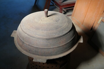 A huge rice cooker made of cast iron that was used in Korea in the past