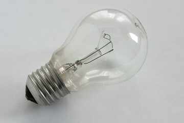 Incandescent light bulb on white background