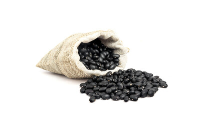 Black beans in burlap isolated on white background