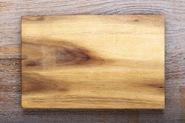 Chopping kitchen boards on a wooden background. Top view flat lay.