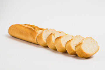 Sliced french baguette on a white background with space for text
