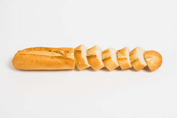 Sliced french baguette on a white background with space for text