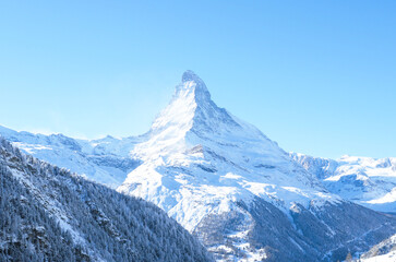 The Matterhorn mountain, scenic view on snowy landscape in winter, Switzerland