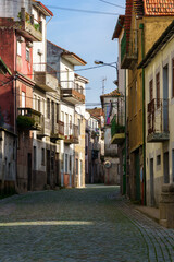 Fototapeta na wymiar portuguese village town cobbled street with lined homes