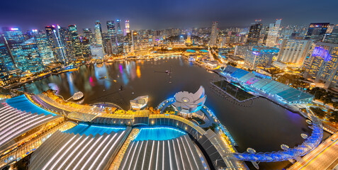 Fototapeta na wymiar Panoramic Aerial view Singapore city skyline at night, Singapore , hotel and financial business building around Marina bay at night with building light .
