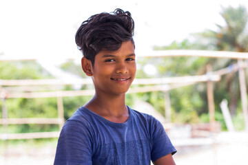 Portrait of Indian boy smiling on the Street