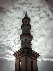 Obraz premium Architecture tower design of Masjid Al - Yusraw or Al - Yusraw Mosque with sky background. Muslim mosque, Islamic art concept, Space for text, Selective focus.