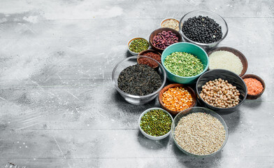 Obraz na płótnie Canvas Organic food. Assortment of legumes in bowls .