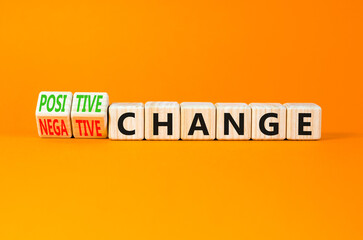 Positive or negative change symbol. Concept word Positive change Negative change on wooden cubes. Beautiful orange background. Business positive negative change concept. Copy space