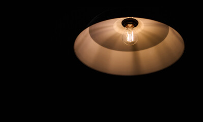 The electrical light bulb on black background