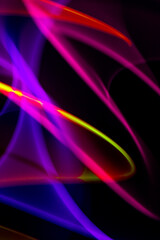 Neon Wavy Light Nightclub Background Swirls on Black Background