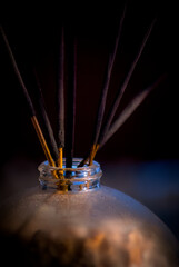 dusty glass incense holder with incense sticks