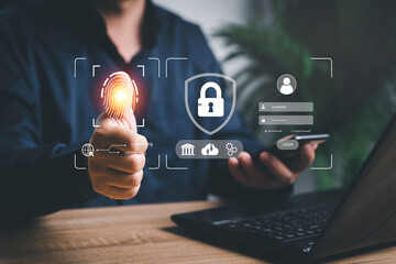 Business cybersecurity concept , Businessman use laptop and smartphone fingerprint scanning access security and identification to access personal data management Cyber ​​Security Digital Technologies.