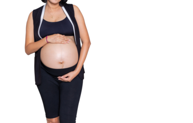 Portrait of a pregnant woman touching her big belly close up, mother, pregnancy, people and expectation. Woman holding big pregnant stomach