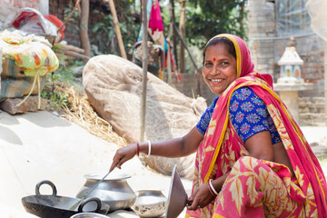 Rural Indian Woman Cooking Lunch On Clay Stove