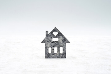 House on white. Wooden miniature house. Real estate and credit concept.