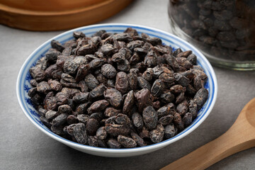 Bowl with Chinese salted black beans as an ingredient close up  